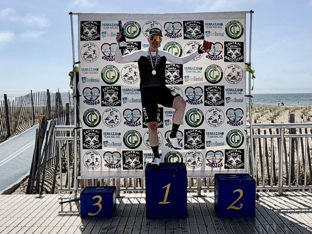 David celebrating on a cycling podium