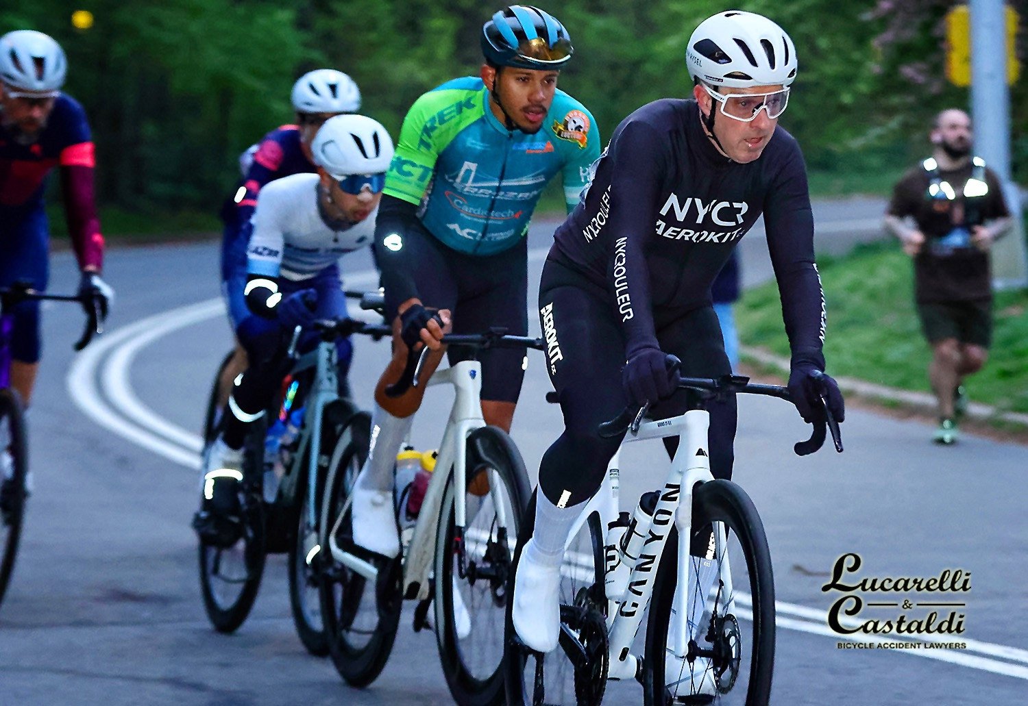 David riding with a group of cyclists in a road race